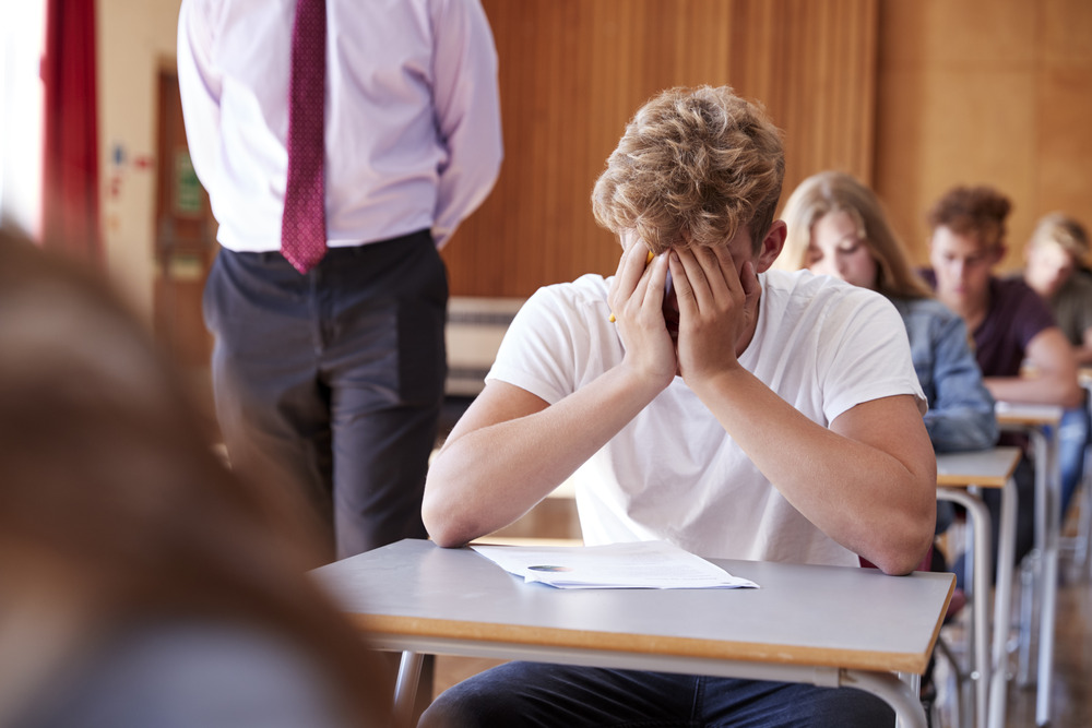 teenager struggling with academic performance from alcohol abuse