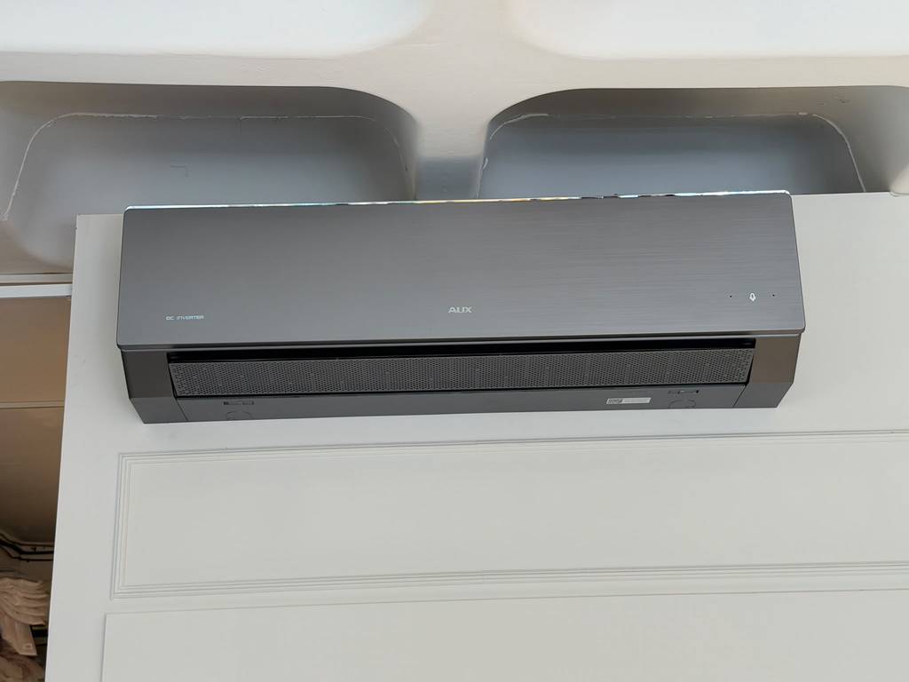 Close-up of AUX DC Inverter brushed metallic finish unit