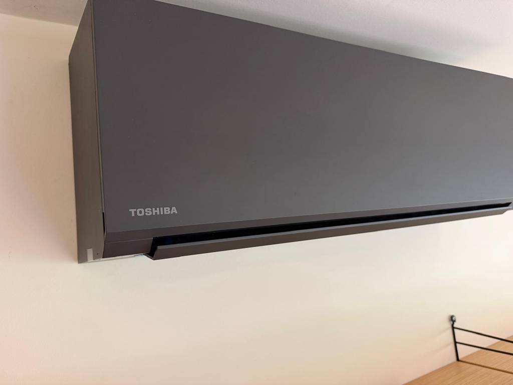 Close-up detail of Toshiba Haori indoor unit showing matte finish