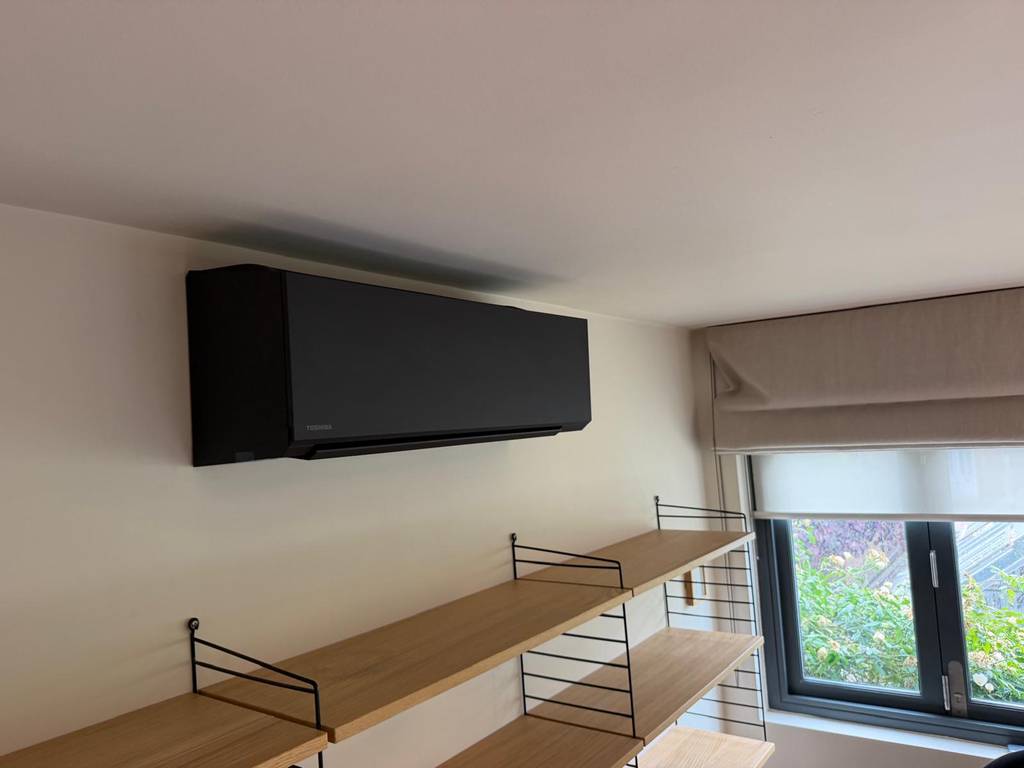 Toshiba Haori matte black indoor air conditioning unit installed on wall