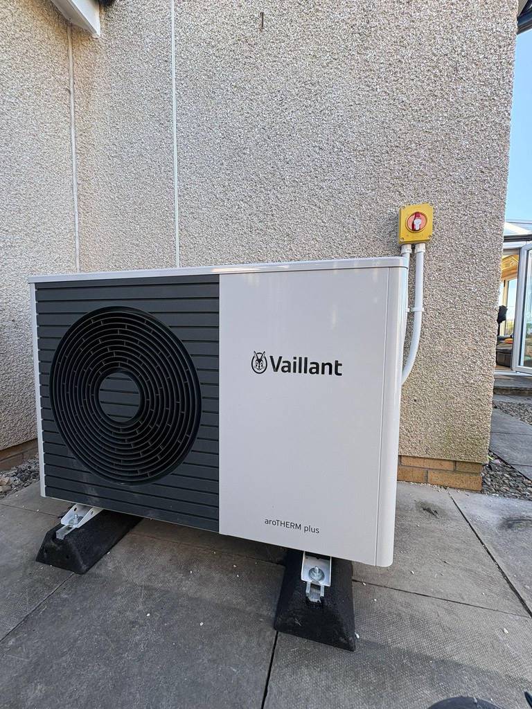 Vaillant aroTHERM plus 3.5kW heat pump unit installed outdoors on anti-vibration feet