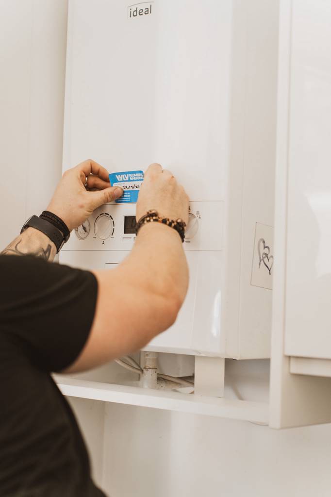 Gas engineer carrying out boiler service and maintenance