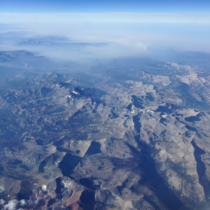 Smoke from a forest fire hovers over the Sierra Nevada.