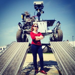 Image of Tanya Harrison with a Mars rover