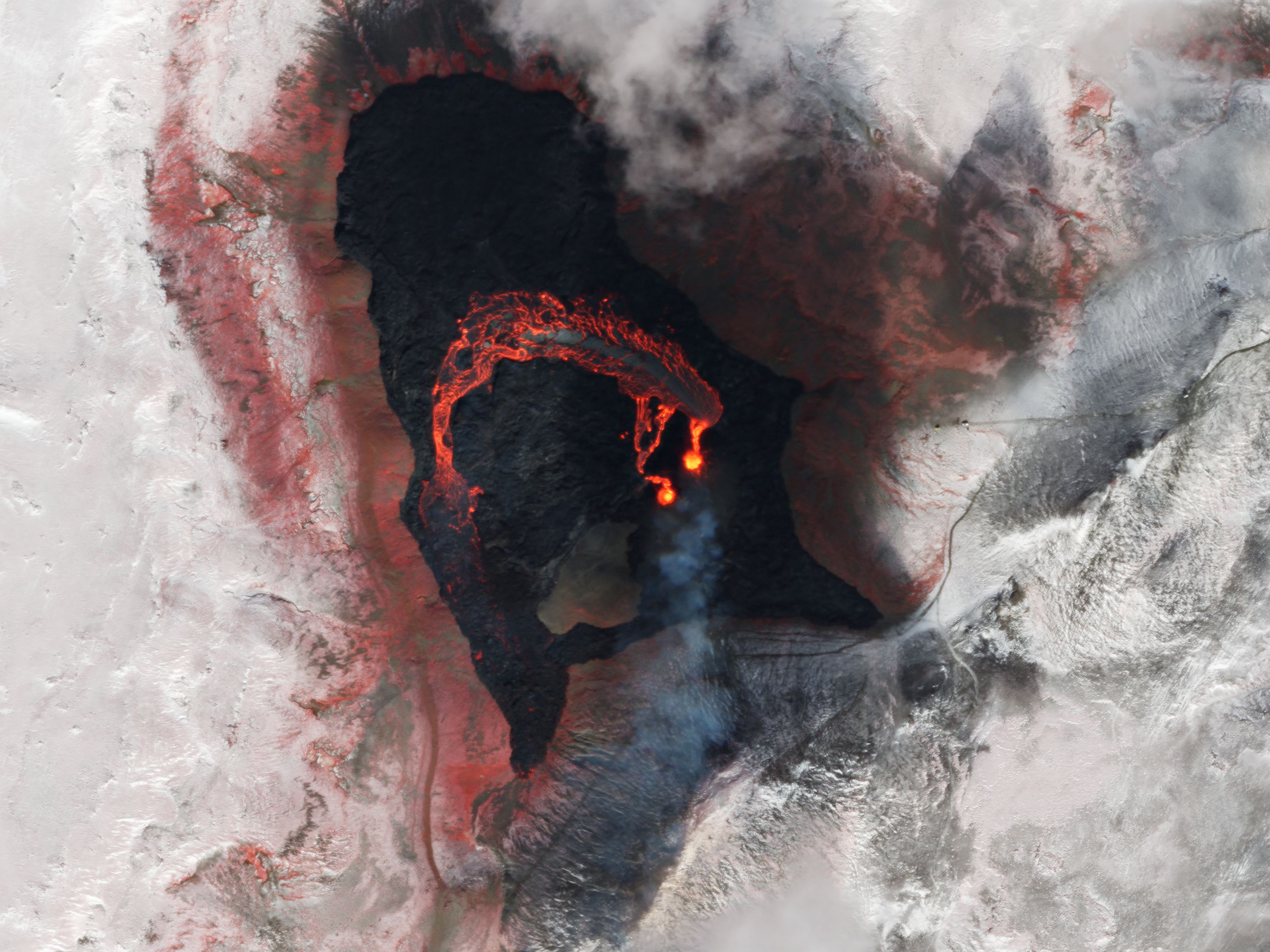 False-color (near infrared, red, and green) light helps highlight the path of the molten lava at Fagradalsfjall Volcano. © 2021, Planet Labs Inc. All Rights Reserved. 