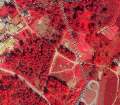 This false-color (near infrared, red, and green) SkySat image collected on March 3, 2021, shows the state of vegetation surrounding distribution lines near Campo, Portugal. Four-band imagery helps provide needed information on vegetation health & vigor. © 2021, Planet Labs Inc. All Rights Reserved.