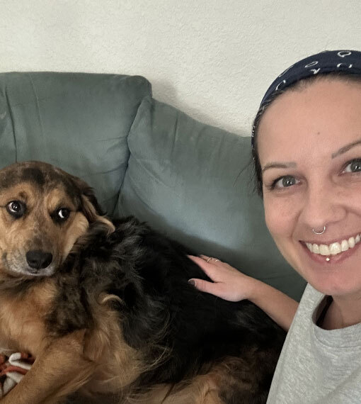 Photo of a woman with her brown dog