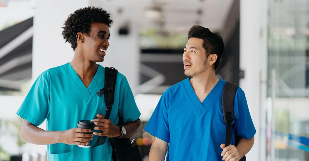 Male nurses walking together