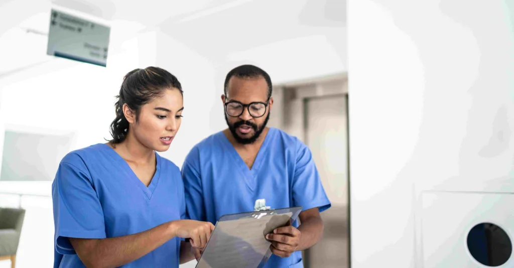 Two nurses reviewing a chart