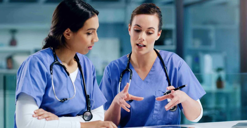 Two nurses supporting each other