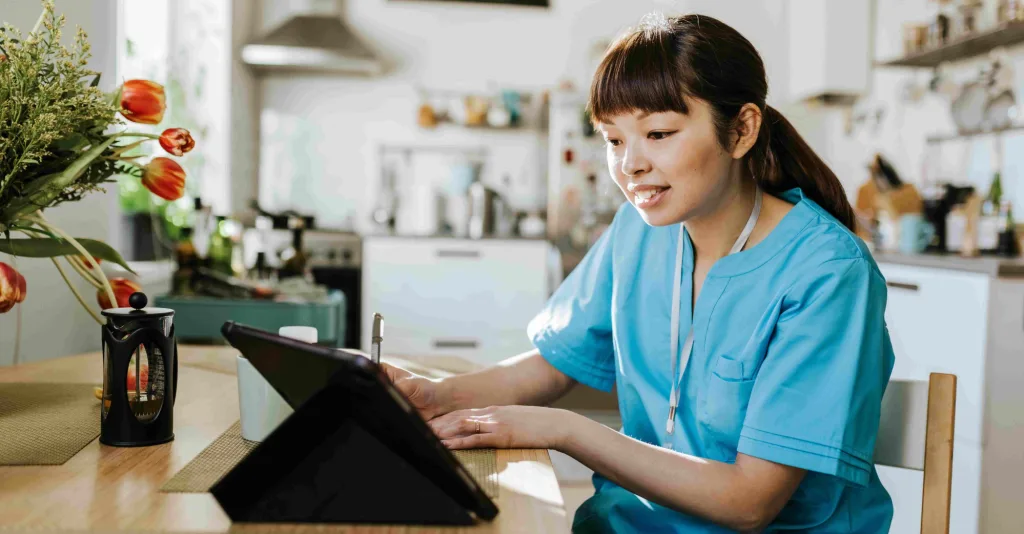 Nurse working on ipad from home