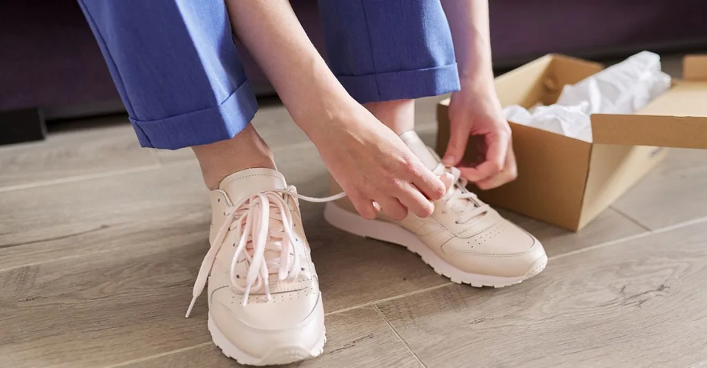 Nurse putting on nursing shoes