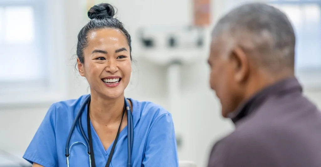 A public health nurse talks with a patient.