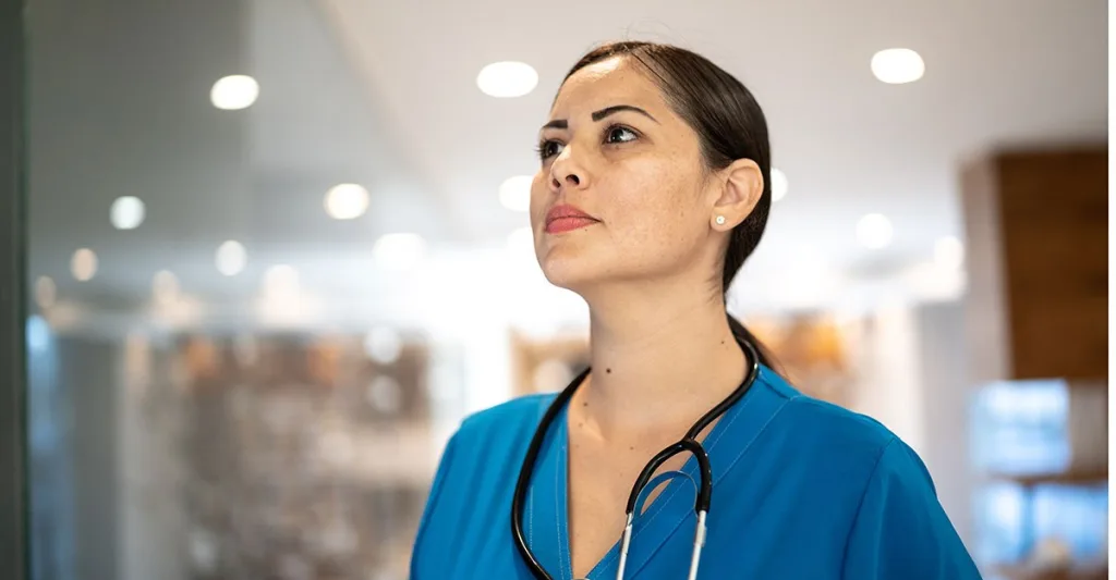 Female nurse using critical thinking in her nursing role