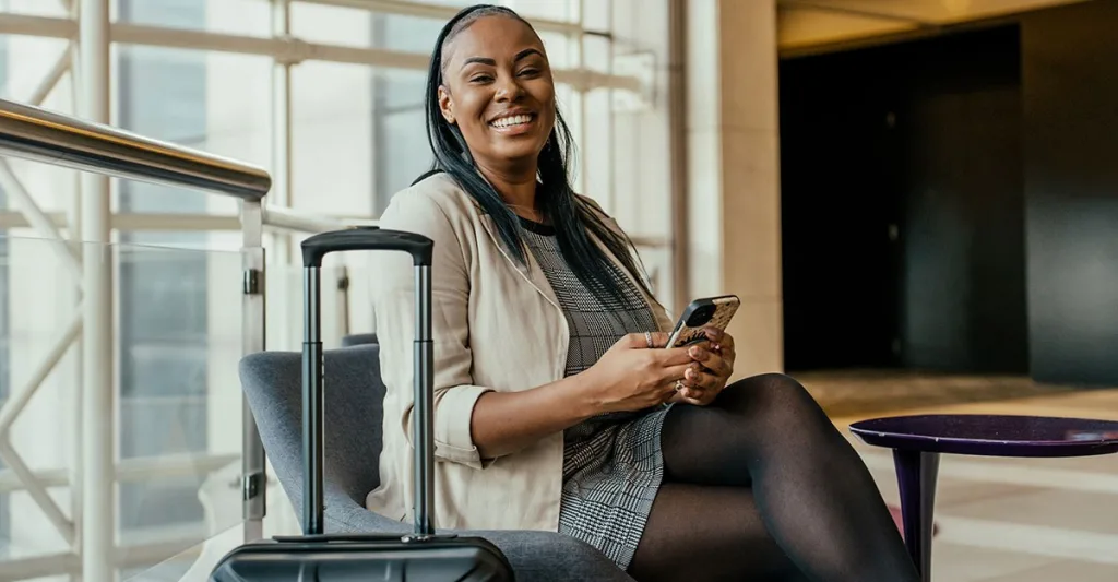 Woman in airport smiling