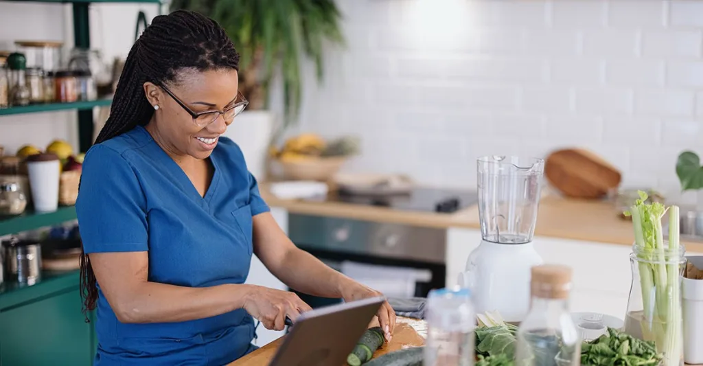 Nurse preparing meals for effective nutrition in nursing