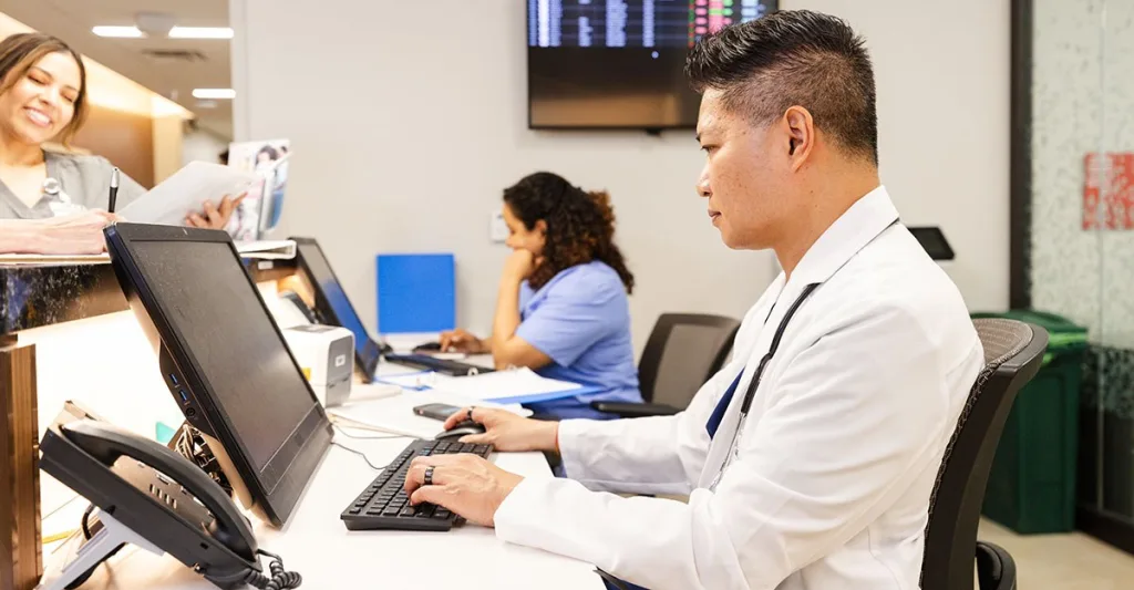 Nurse at EHR system computer