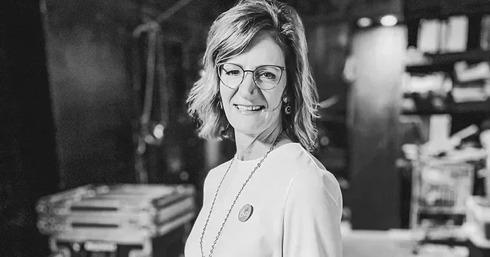 A black and white photo of a nurse in casual clothing