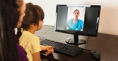 Pediatric nurse during a telehealth appointment