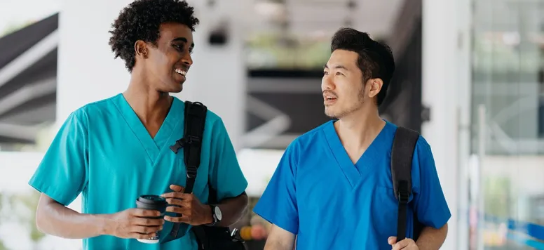 Male nurses walking together