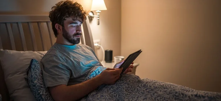 Man reading in bed