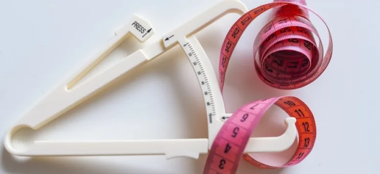 Image of calipers and tape measure to user BMI formula