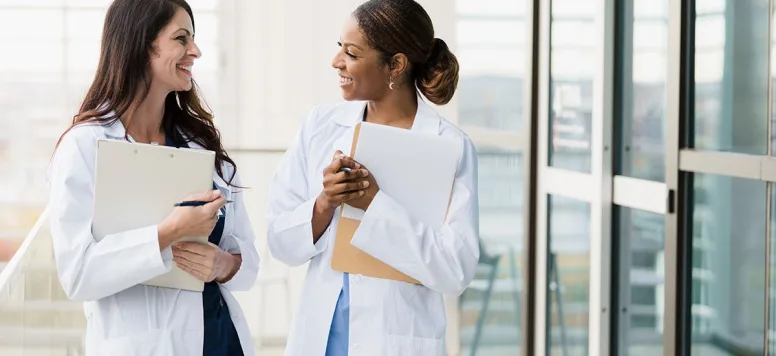 Two women in lab coats