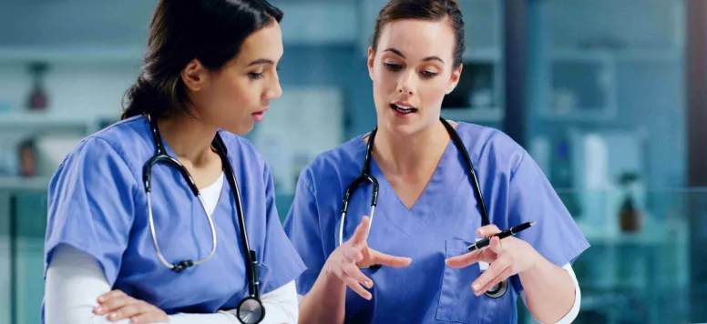 Two nurses supporting each other