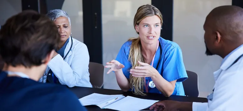 Nurses and other healthcare professionals in a meeting