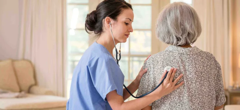 Nurse using stethoscope