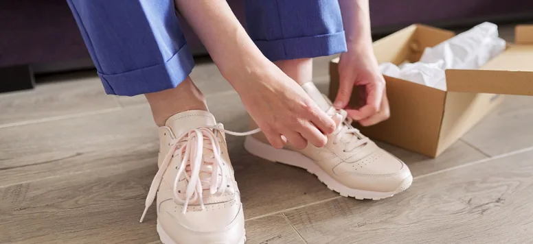 Nurse putting on nursing shoes