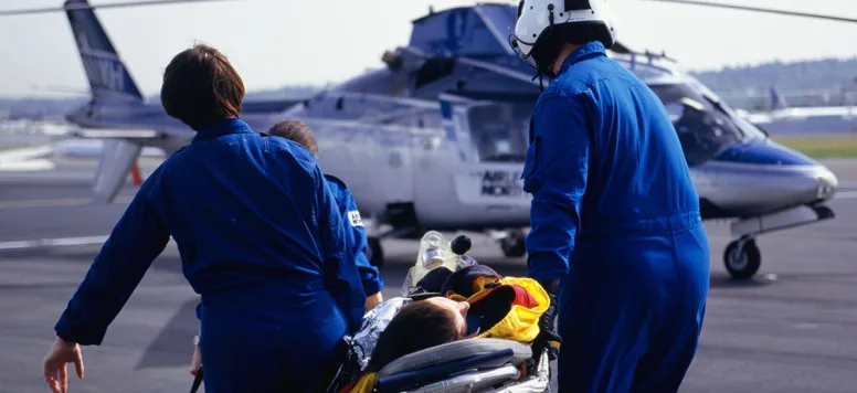 flight nurse working with a team