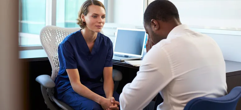 A nurse looking at a patient