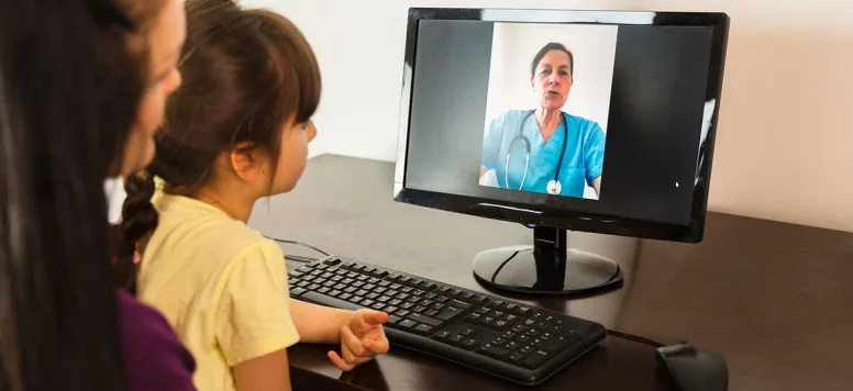 Pediatric nurse during a telehealth appointment