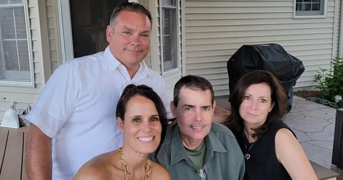 Family standing on their back patio