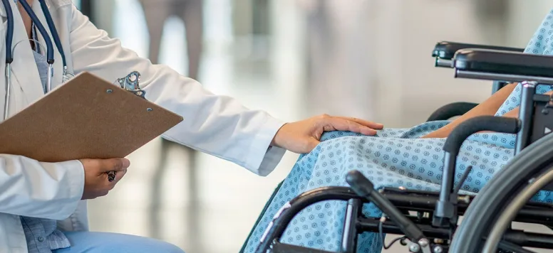 Nurse with patient in wheelchair