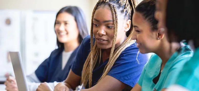 Nurses reviewing continuing education on computer