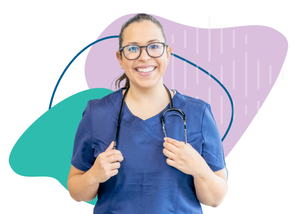 Female nurse in dark blue scrubs smiling and holding her stethoscope