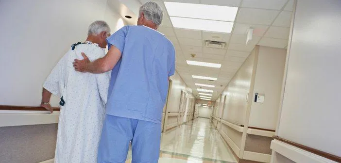 Nurse talking patient down the hall