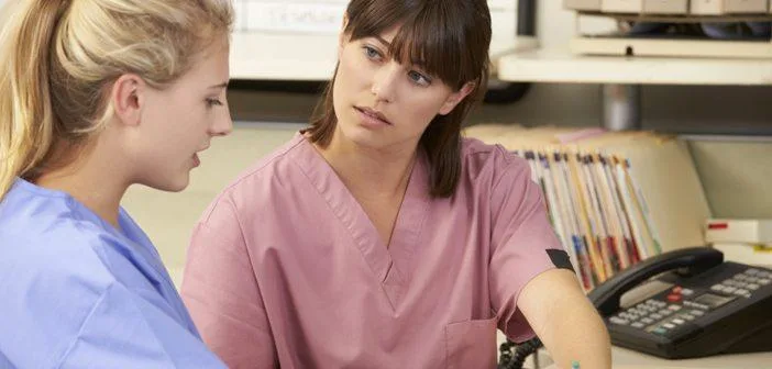 Two nurses talking about a case