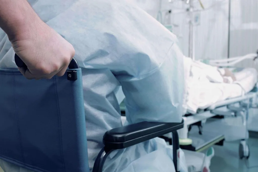 Patient being pushed in wheelchair