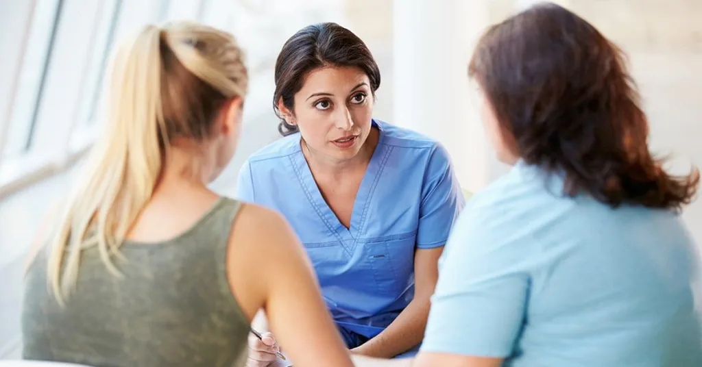 Nurse talking with family