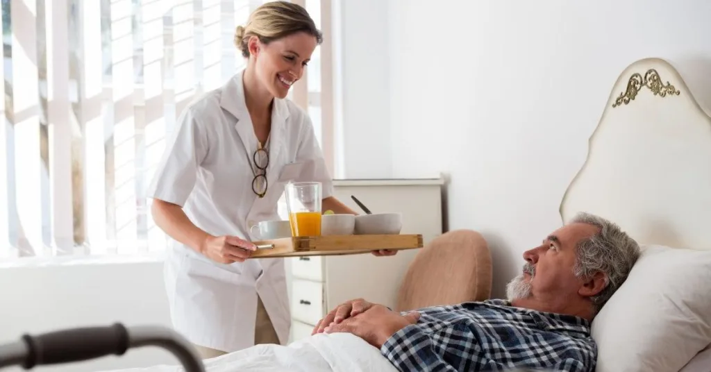 Nurse-patient-food-tray-GettyImages-837336882.jpg