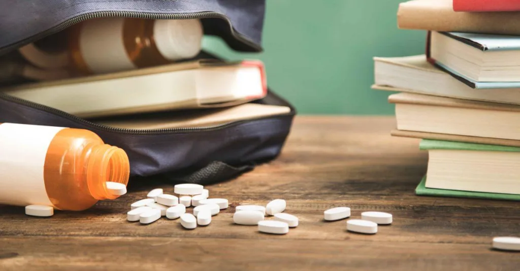 Pills falling out of a school backpack