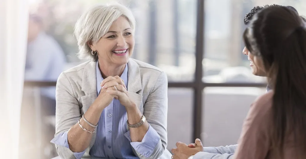 Older-woman-listening-to-couple-FB-GettyImages-1058833078.jpg