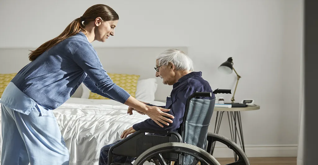 Nurse-with-elderly-man-in-wheelchair-FB-GettyImages-1251255818.jpg