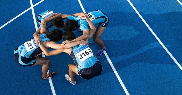 Track team in a huddle