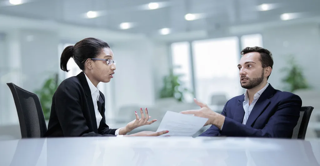 Male-and-female-arguing-or-discussing-at-table-FB-GettyImages-637914714.jpg