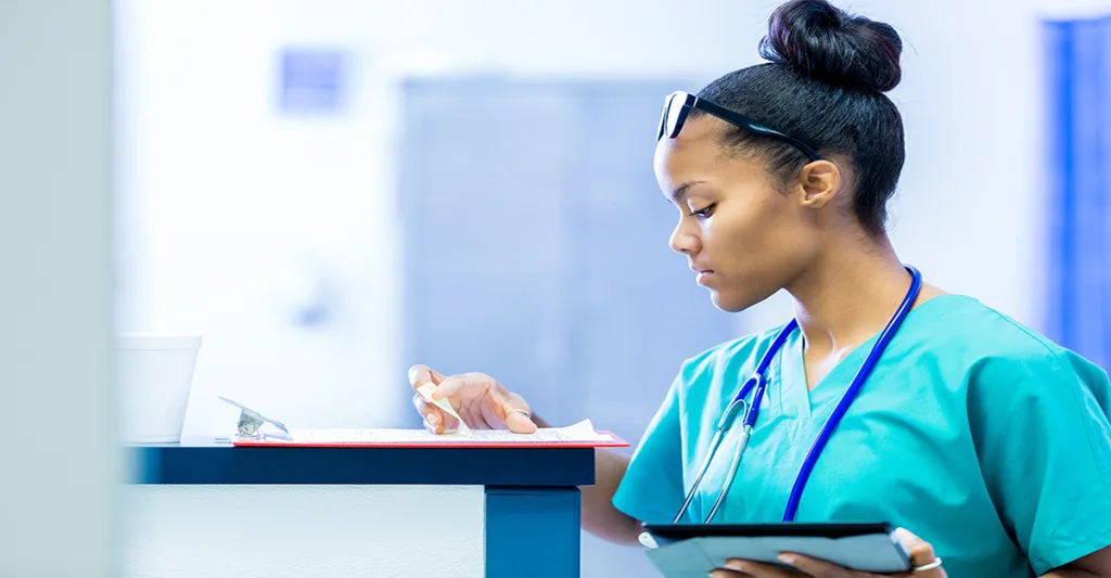 Nurse-looking-at-chart-FB-GettyImages-491669480.jpg