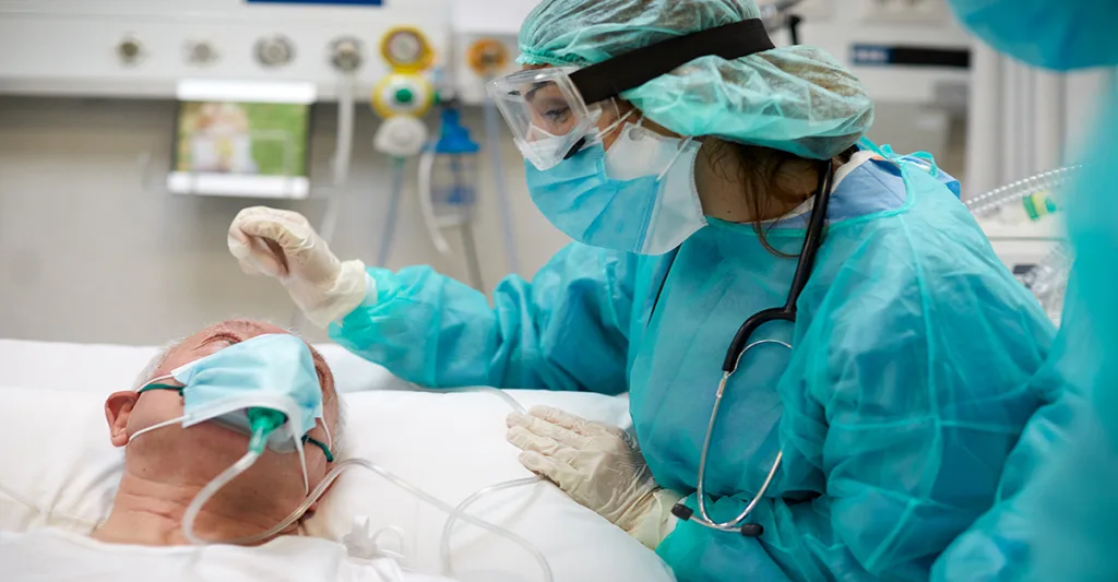 Nurse-comforting-ICU-patient-FB-GettyImages-1255592872.jpg